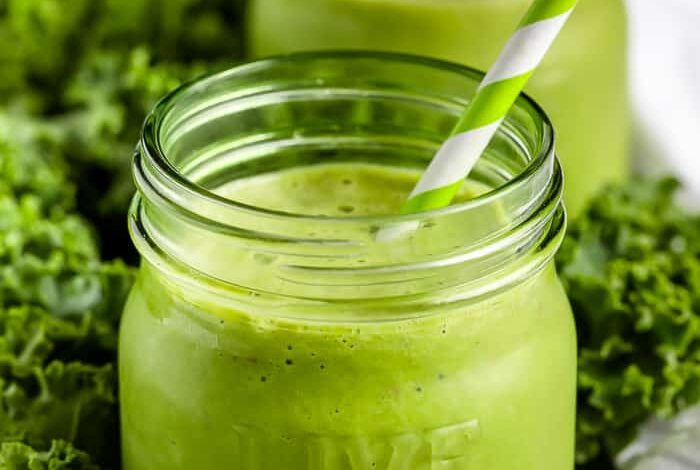 Kale Smoothie in two mason jars with straws