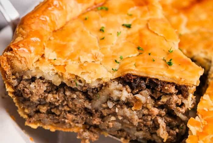 Savory Meat Pie slice taken out of the pie to show filling