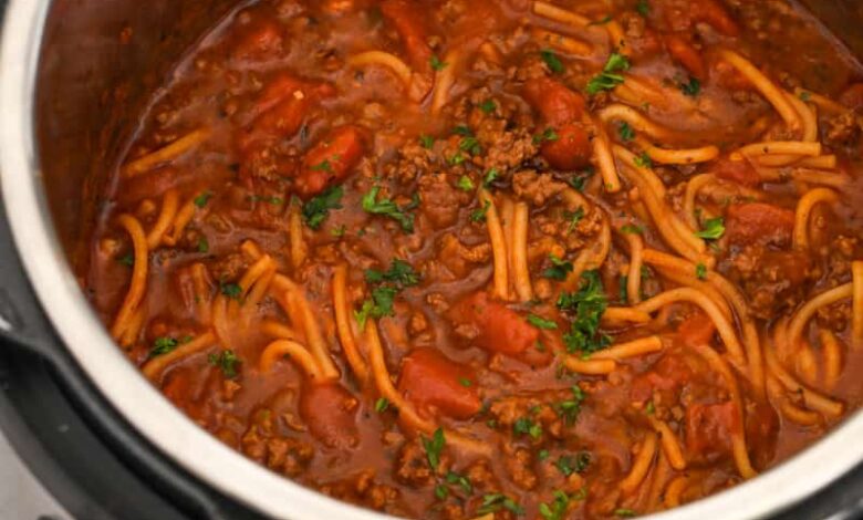 cooked spaghetti and meat sauce in a pressure cooker