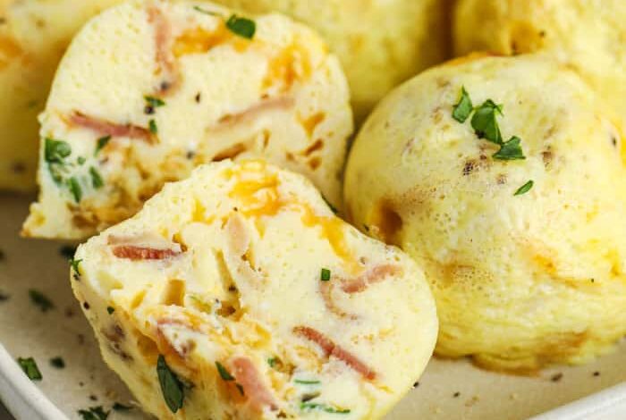 close up of Air fryer Egg Bites on a plate with one in half