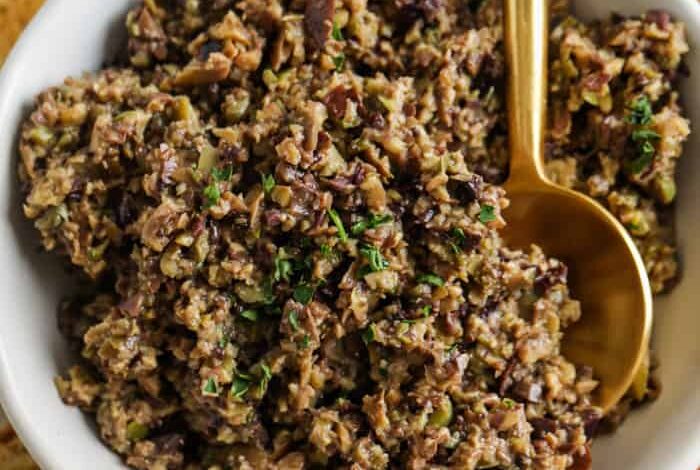 Tapenade in a dish with bread slices