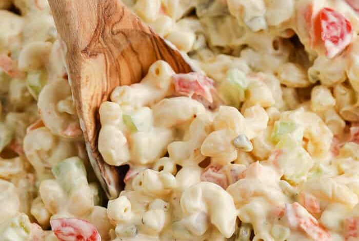 serving macaroni salad with a spoon