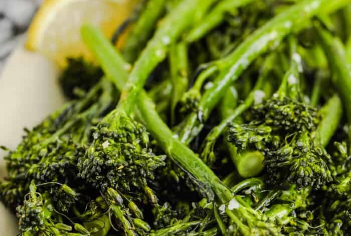 Air Fryer Broccolini on a plate with lemon