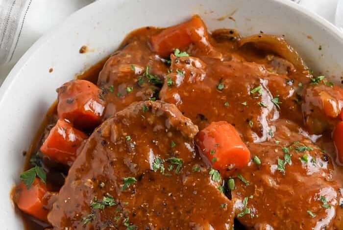 Swiss Steaks covered in gravy in a bowl