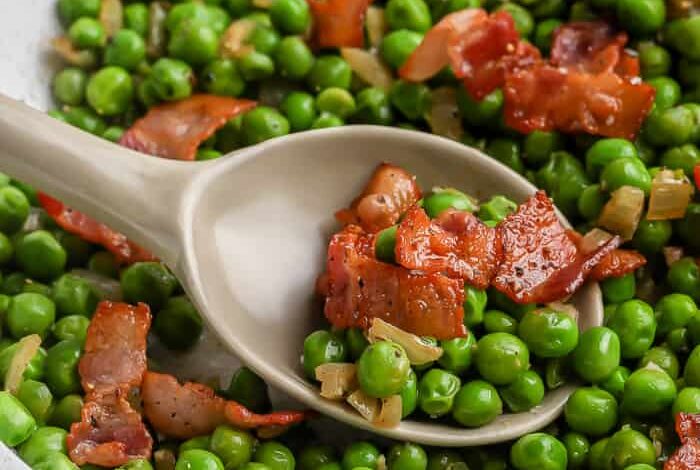 spoon scooping Green Peas with Bacon