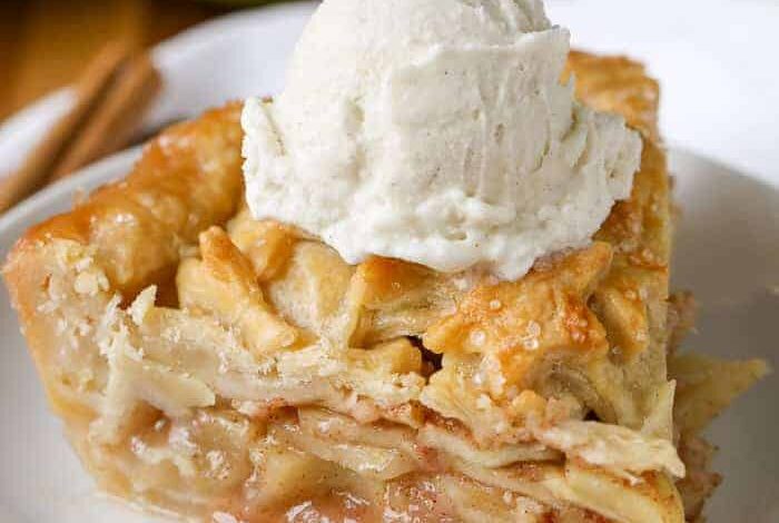 Homemade Apple Pie with vanilla ice cream on a white plate