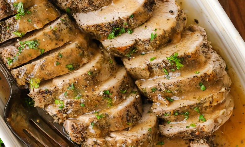 Pork tenderloin on a plate with gravy