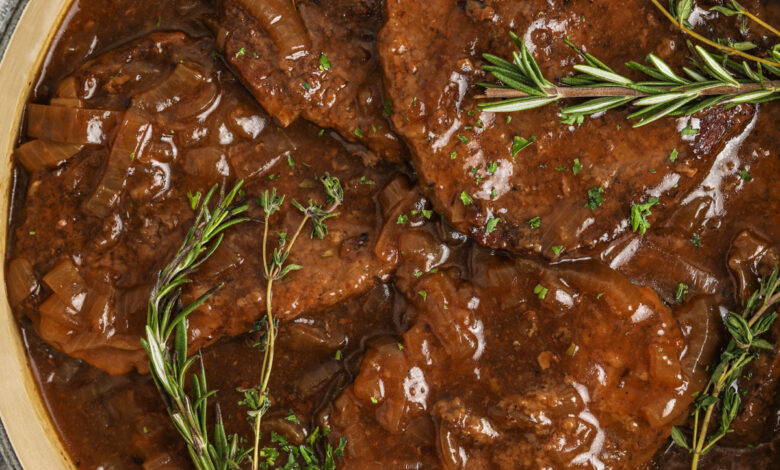 pan full of Cube Steaks with Balsamic Onion Gravy