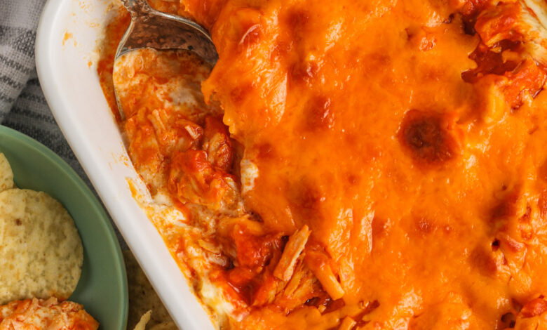 cooked Easy Buffalo Chicken Dip with chips and a spoon