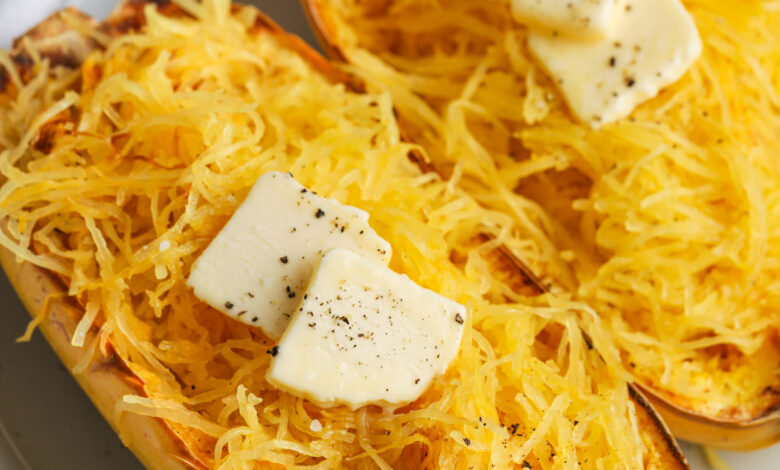 Air Fryer Spaghetti Squash on a plate with pats of butter on each