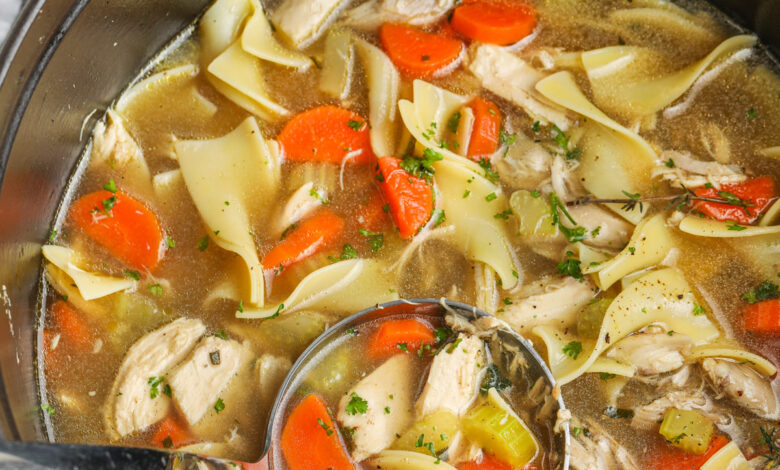 pot of Classic Chicken Noodle Soup with a ladle