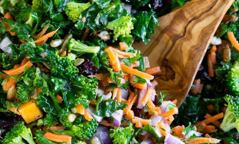 Easy Kale Salad in a bowl with a serving spoon