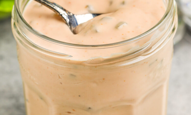 Thousand Island Dressing being scooped out of a jar