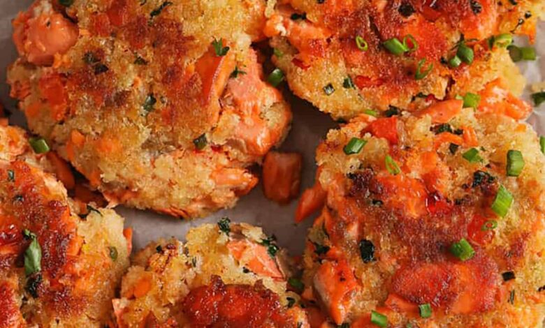 cooked Salmon Croquettes on a plate with lemon slices