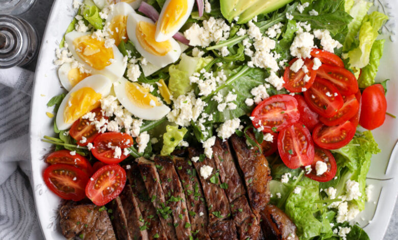 steak salad on a plate with fresh vegetables