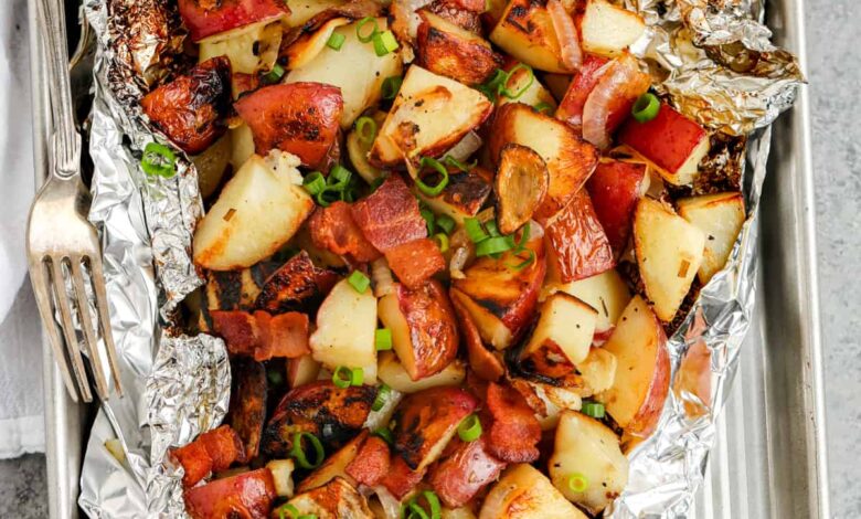 Grilled Red Potatoes on a sheet pan with green onions