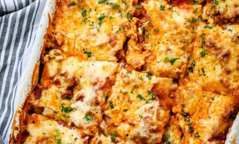 pan of the best baked homemade lasagna on a white plate