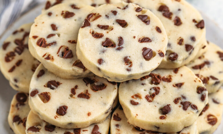 Chocolate Chip Shortbread Cookies on a plate with a glass of milk