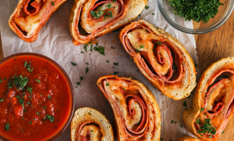 sliced Stromboli Recipe with garnish and dips