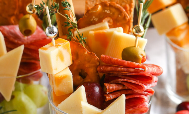 a charcuterie cup filled with meats, cheese and crackers