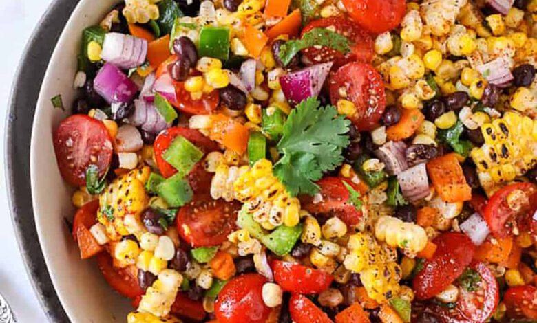 bowl of Black Bean and Corn Salad with limes