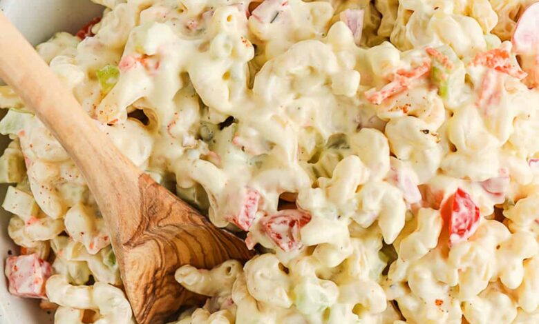serving macaroni salad with a spoon