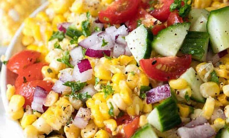 bowl of Fresh Corn Salad with corn in the background