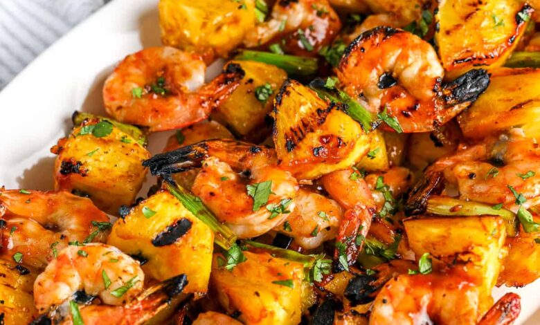 shrimp kabobs piled on a plate