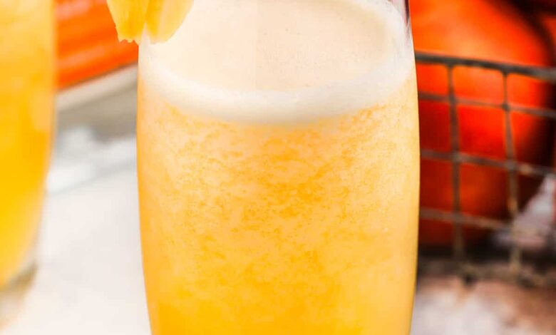 Peach Bellini with peach garnish