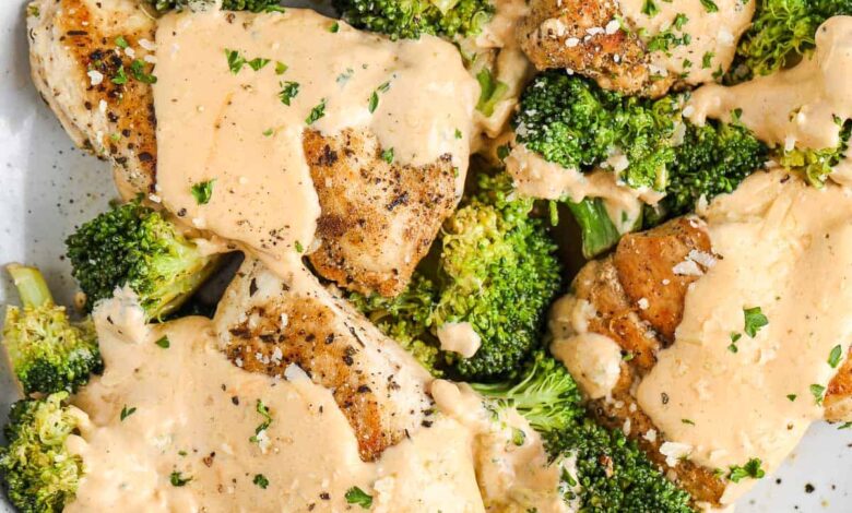 chicken and broccoli with cheese sauce on a serving plate