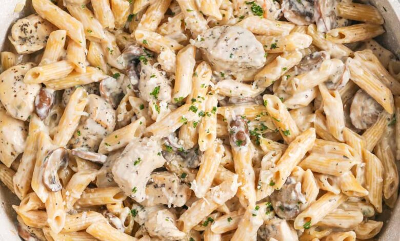 Mushroom chicken with pasta prepared in a frying pan