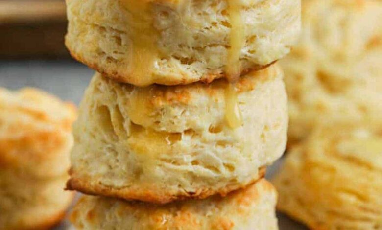 Buttermilk Biscuits in a pile with butter and honey