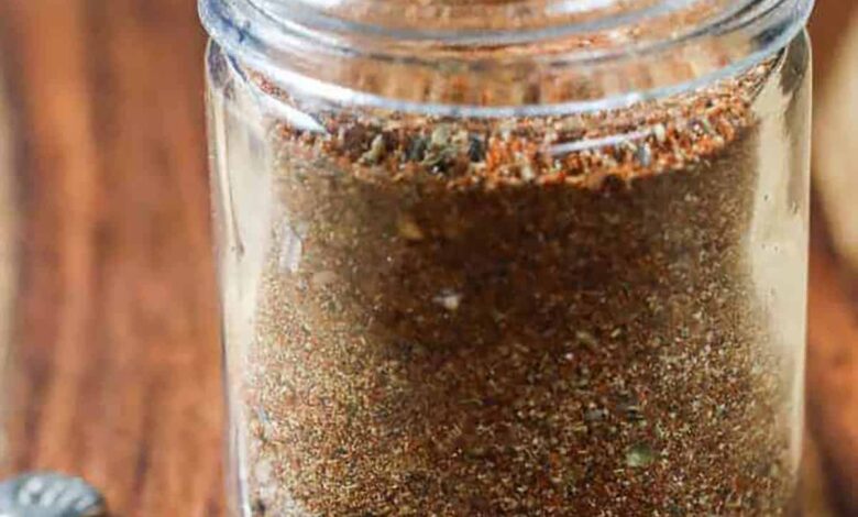 jar of Homemade Taco Seasoning Mix with a spoon full