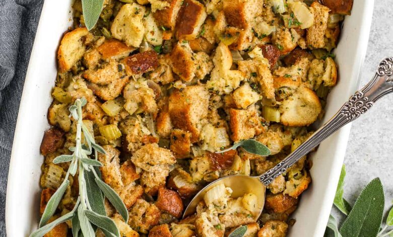 stuffing in a pan with herbs and a spoon