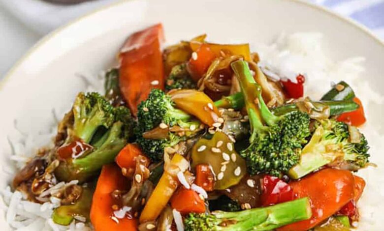 Stir fry sauce served over veggie and rice
