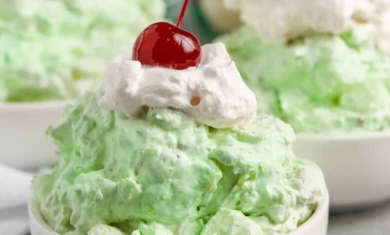 Watergate Salad with whipped cream and a cherry on top