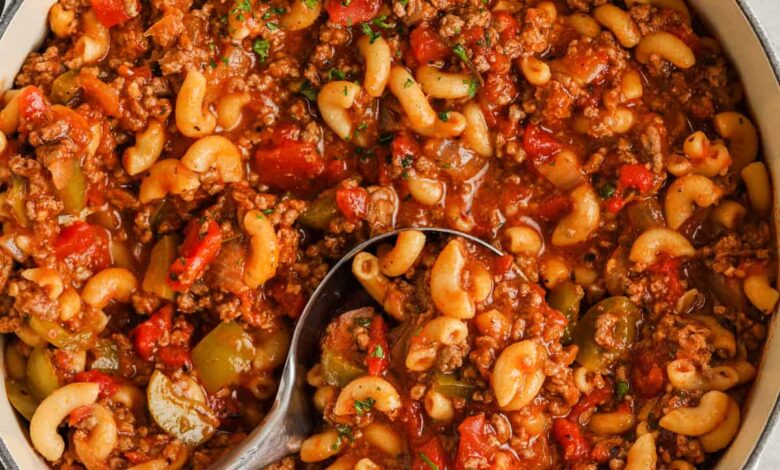 pot full of American Goulash with a spoon