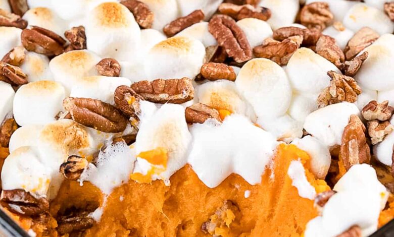 Sweet potato casserole in a dish with a serving scooped out